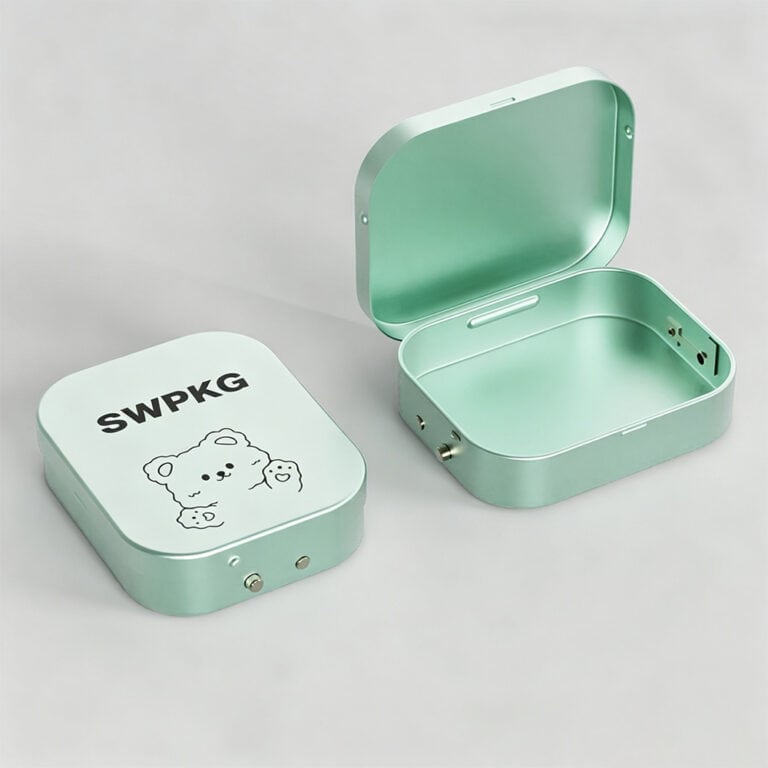 Mint green metal storage case with open lid for cosmetics and perfume.