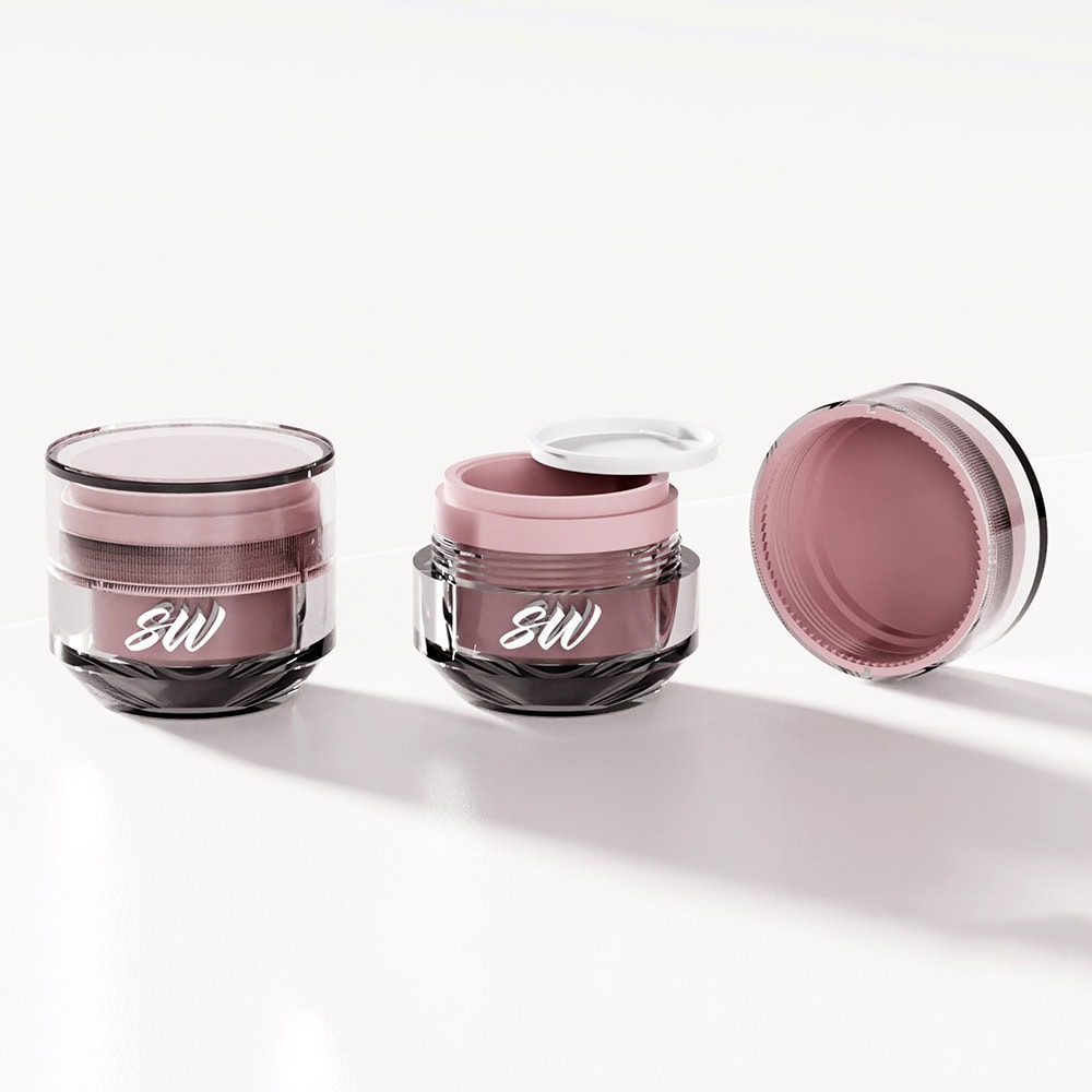 Luxury pink and black acrylic cosmetic jars for skin care products.