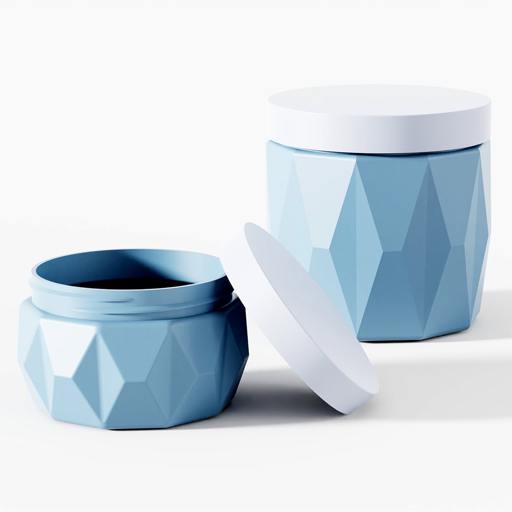 Blue geometric cosmetic jars with screw caps for skin care products.