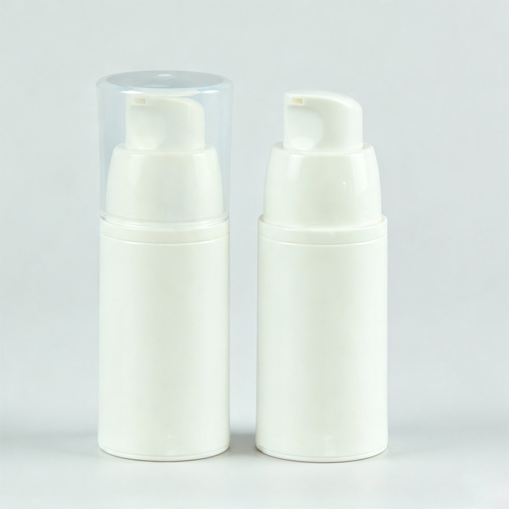 White travel size galvanized airless pump bottles for liquids and foundation.