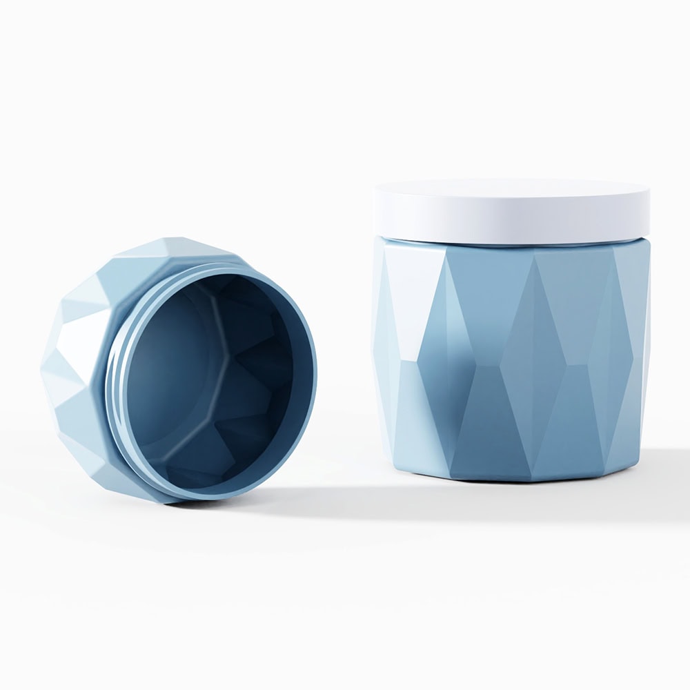 Blue geometric cosmetic jar with screw cap for skin care products.