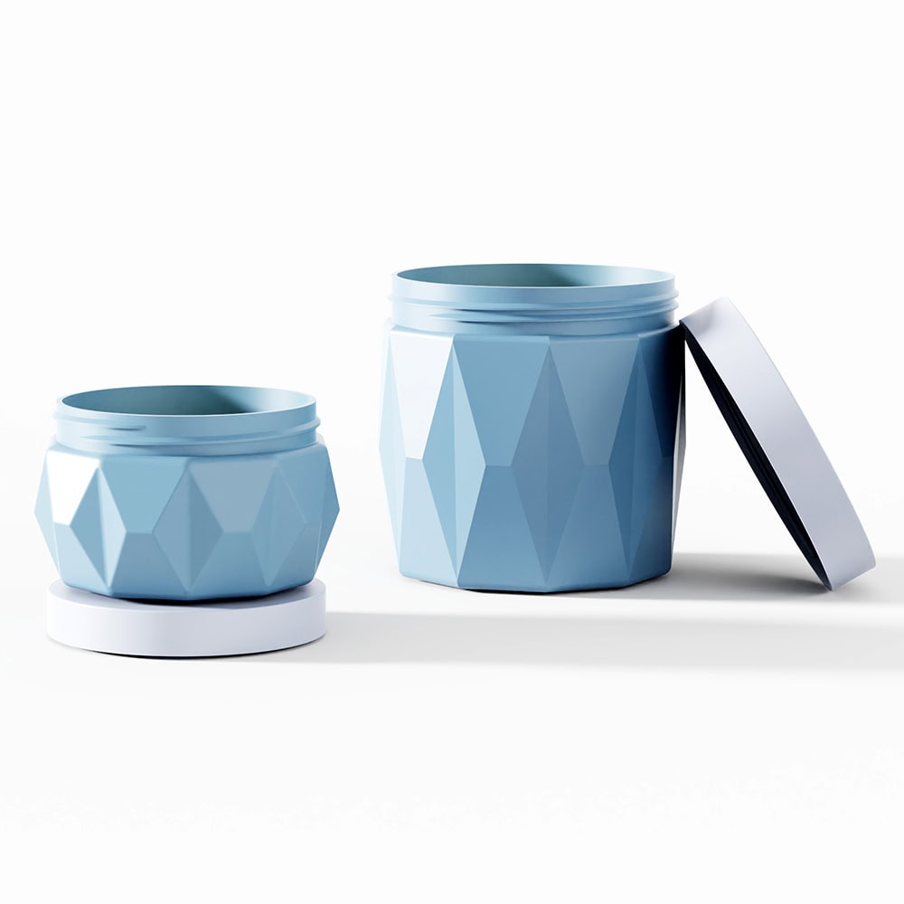 Blue geometric cosmetic jars with screw caps for skin care products.