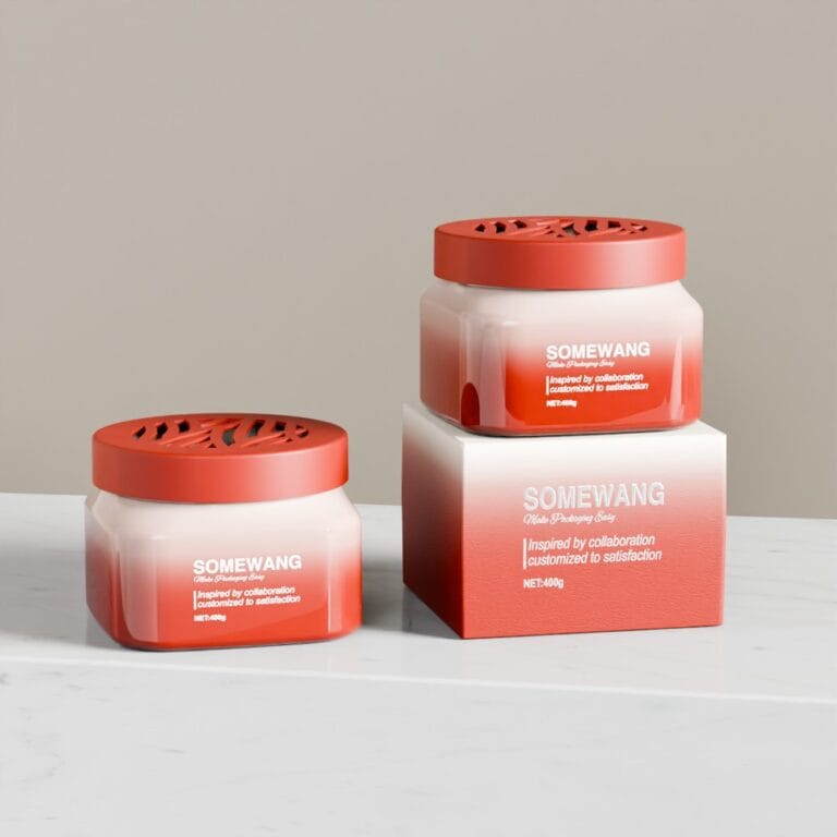 Two cosmetic jars with red lids and white bodies on a white surface.