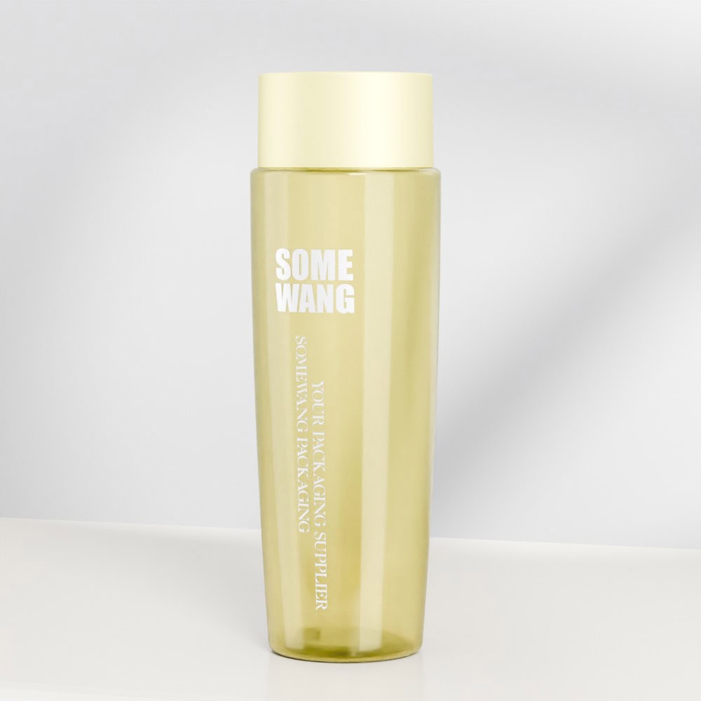 Transparent yellow shampoo bottle with screw cap and printed label.