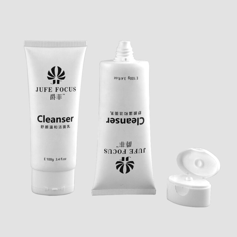 White cosmetic tubes with black logo and text for skincare products.
