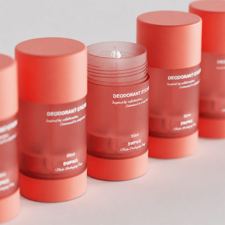 Red cylindrical deodorant stick containers for customized packaging solutions.