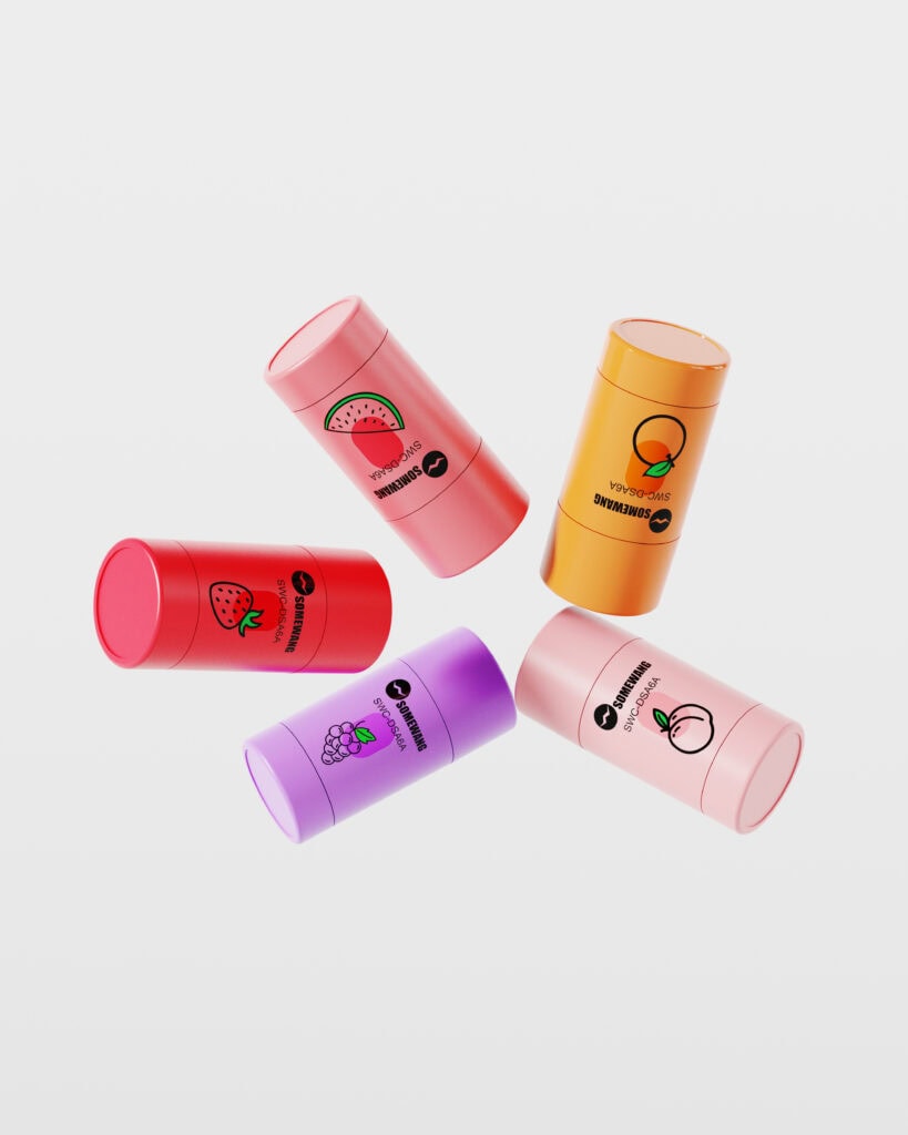 Colorful lip balm containers with fruit illustrations for packaging design.