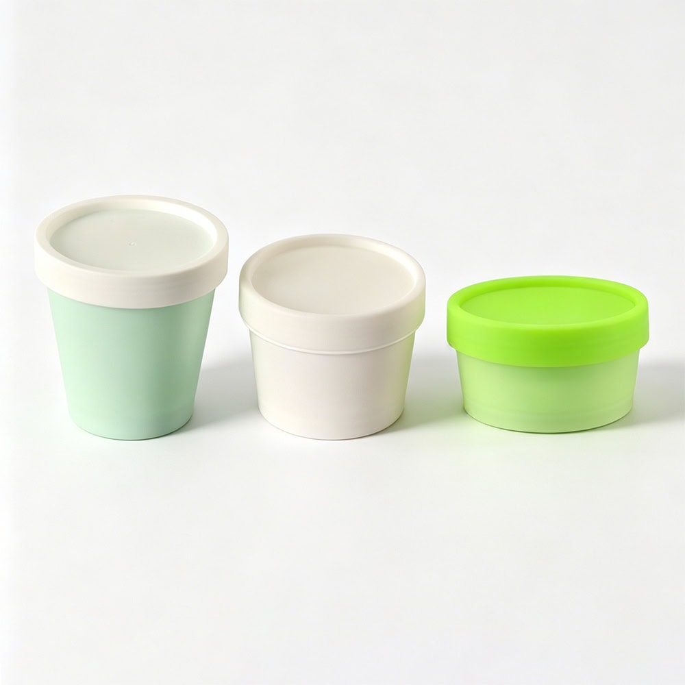 Three PP facial mask jars with screw caps in white, mint green, and lime green colors.