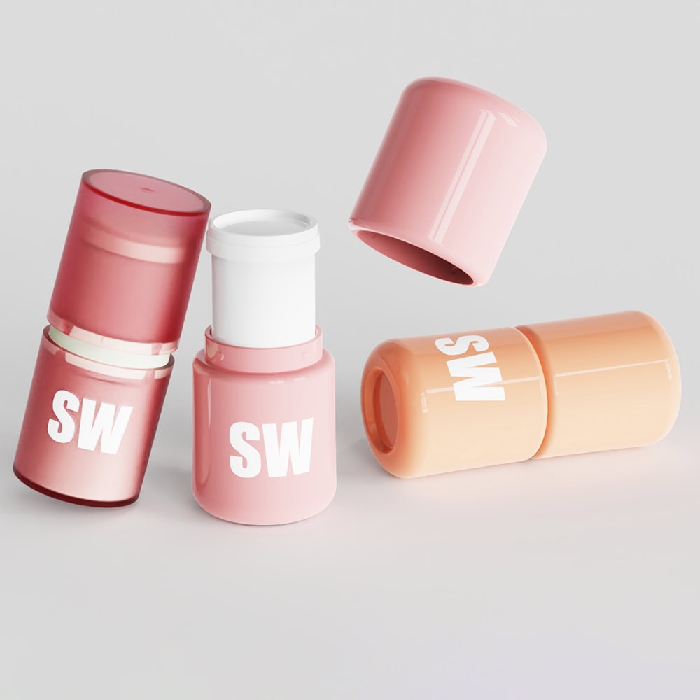 Pink and peach deodorant stick containers with white logo on a white background.