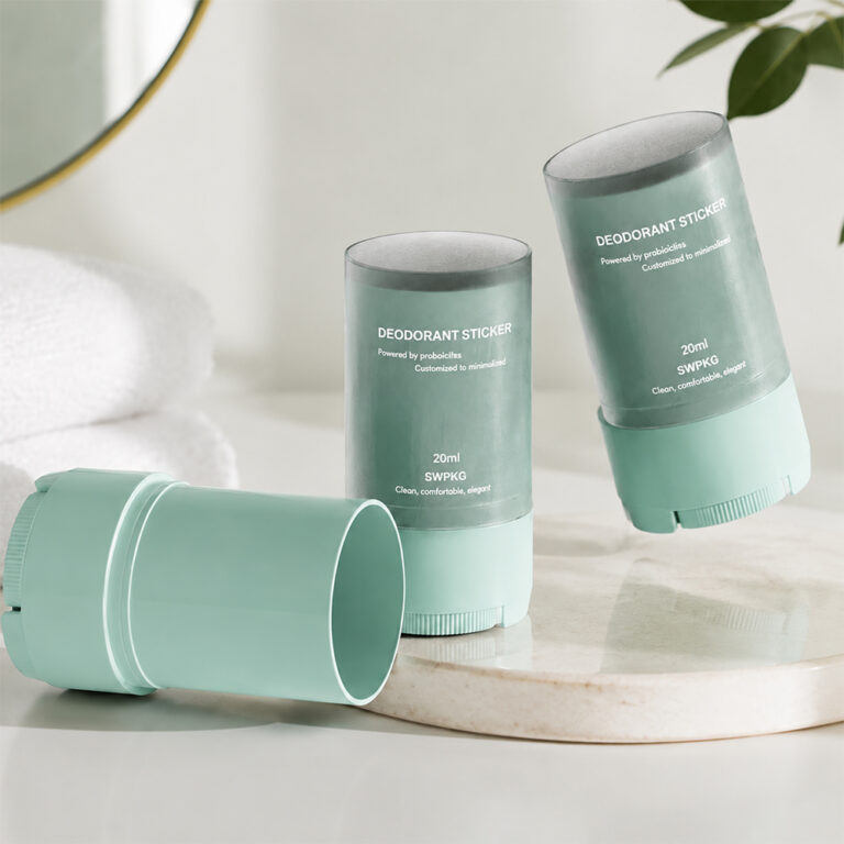 Three pastel green deodorant sticks with clear labels on a white surface.
