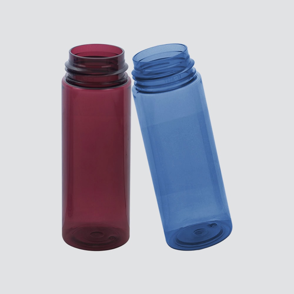 Two colorful PET bottles, one red and one blue, for foam packaging and storage.