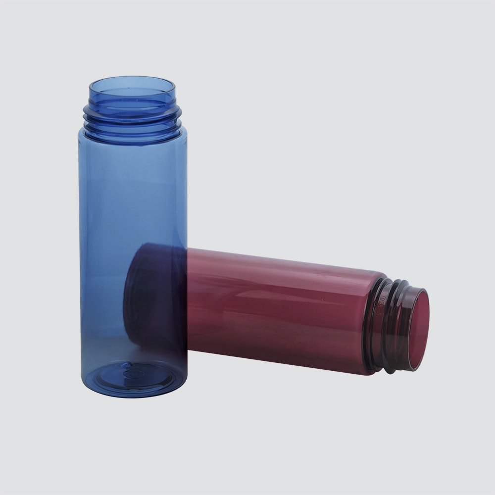 Two colorful PET foam bottles, one blue and one pink, for packaging and storage.