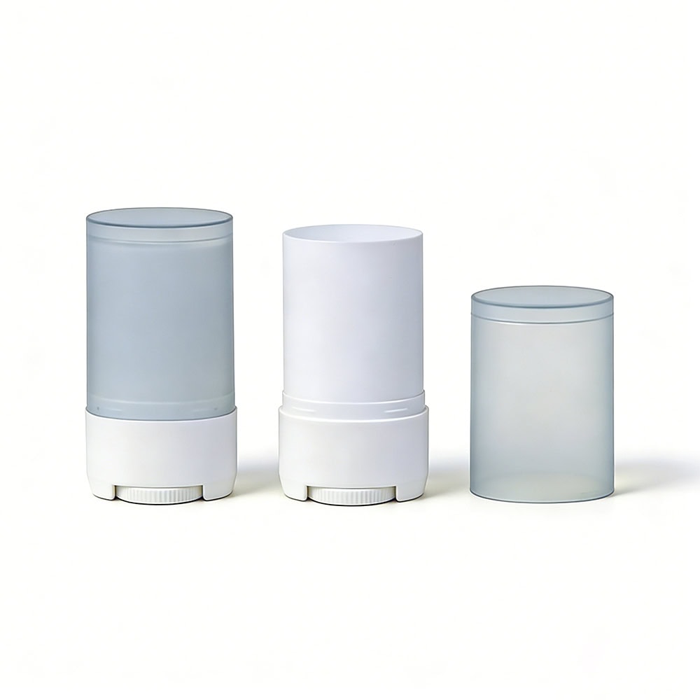 Three different colored deodorant stick containers with white bases on a white background.