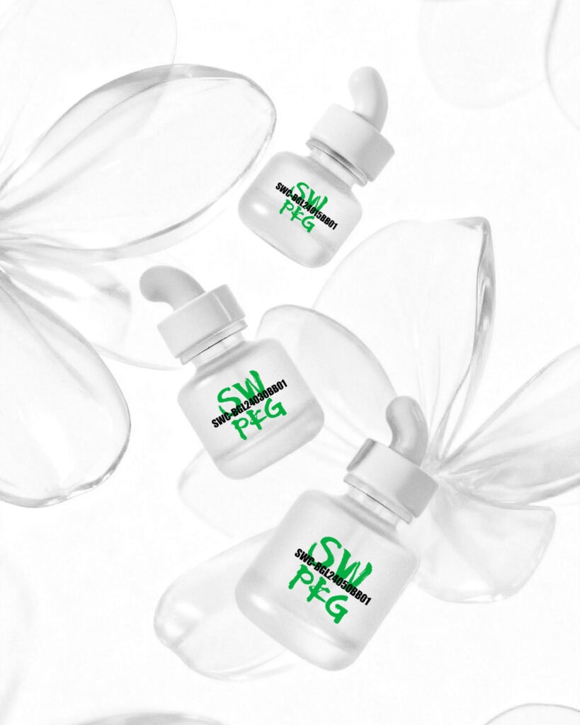 Three white glass serum bottles with droppers on a white background.
