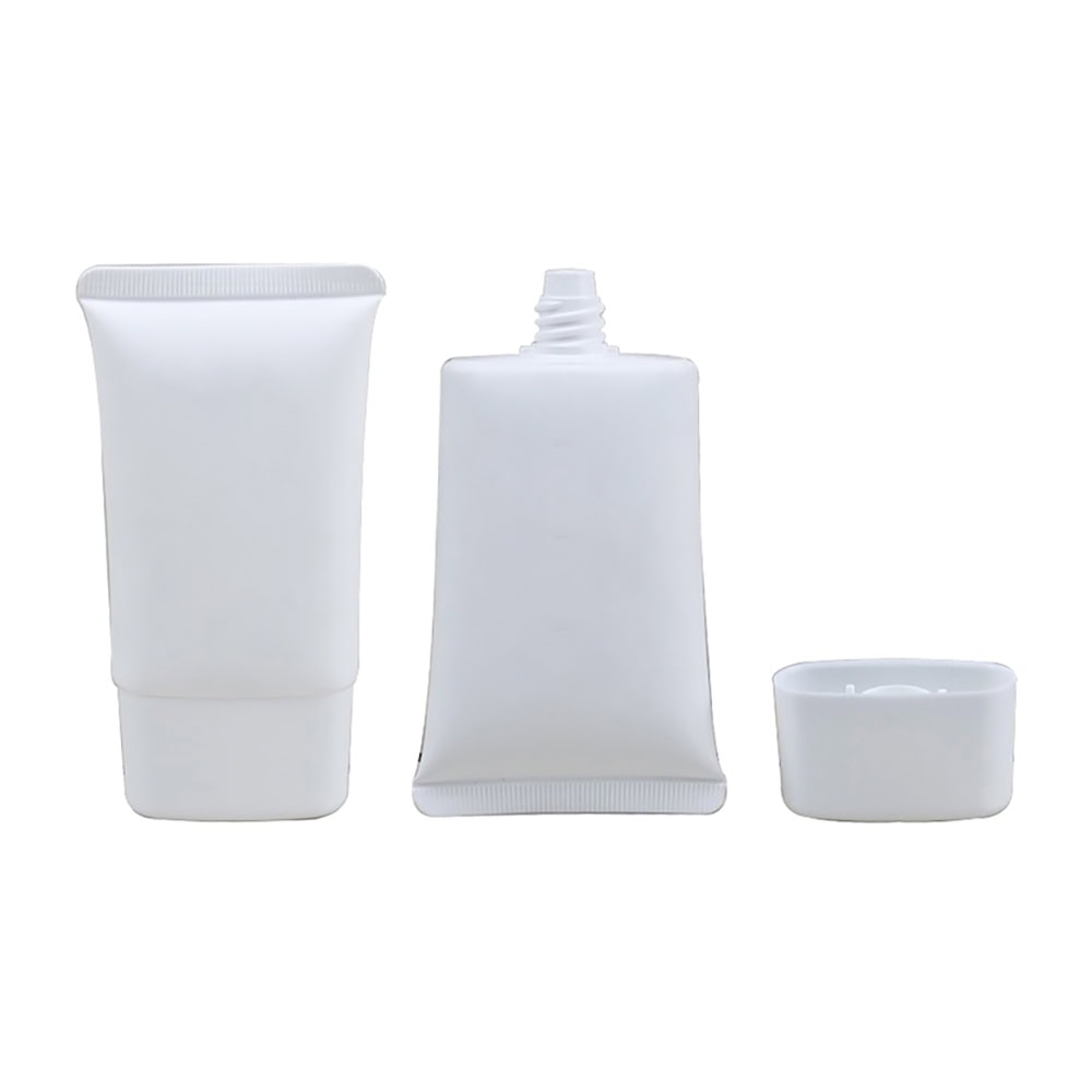 White PE plastic cosmetic tubes with flip top cap for skincare products.