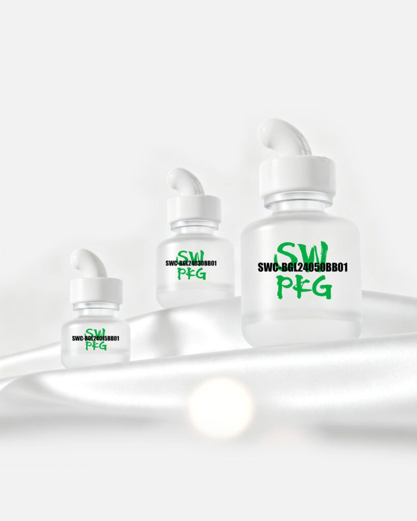 Three clear glass serum bottles with droppers, labeled with green text, on a white surface.
