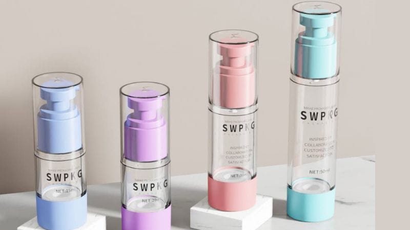 Colorful airless pump bottles for skincare in blue, purple, pink, and turquoise.