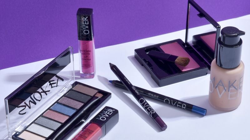 Cosmetic packaging products including lipstick, eyeshadow, foundation, and brushes.