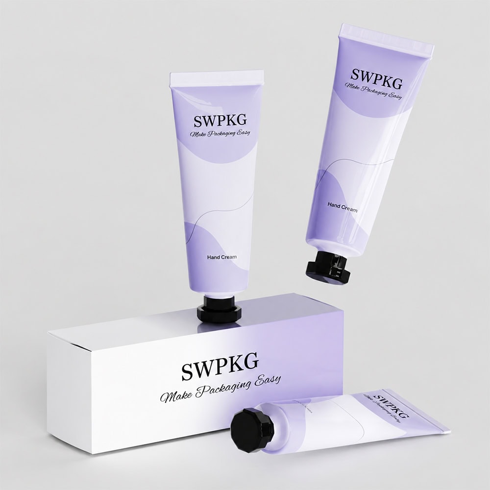 Three purple and white hand cream tubes with black caps on a white box.