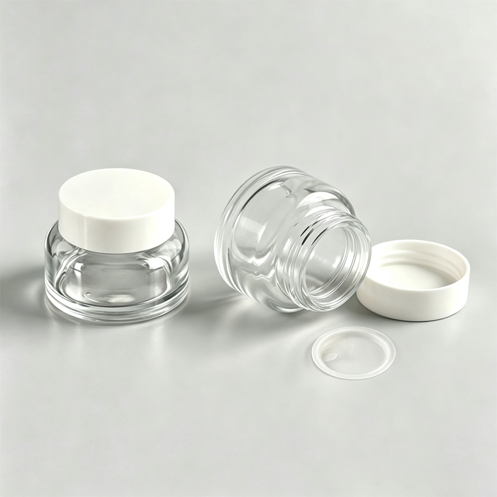 Clear 50ml glass jar with white lid and sealing ring for packaging.